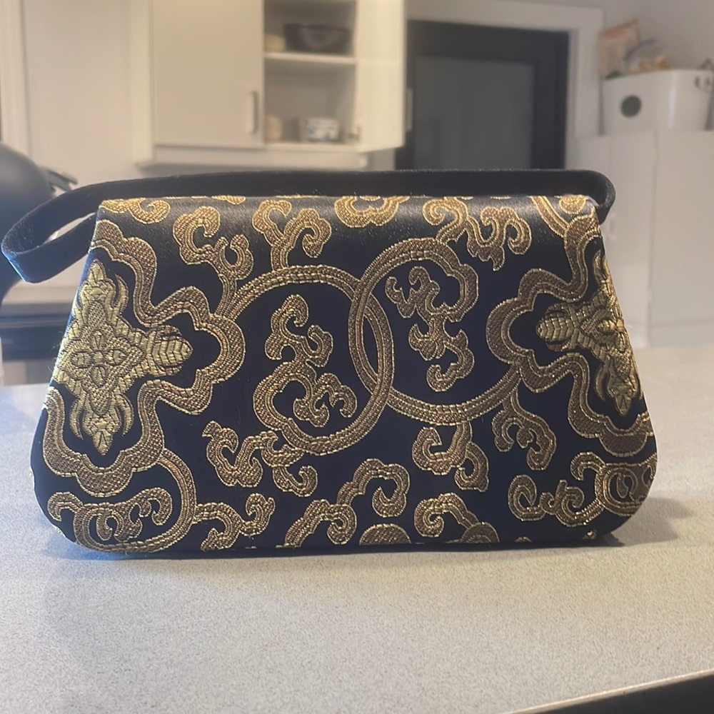 Small handbag with built in compact mirror